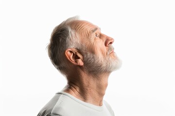 Fototapeta premium Senior man in profile looking up on white background