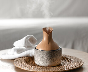 Essential oil aroma diffuser humidifier diffusing water in the air.