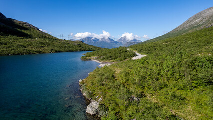 drone aerial view over Vengedalen valley with lake and mountains in summer in Norway Romsdalen and Romsdalseggen Ridge