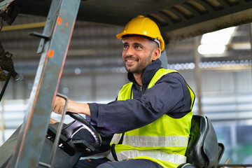  man in a yellow safety vest is driving a forklift © lovelyday12