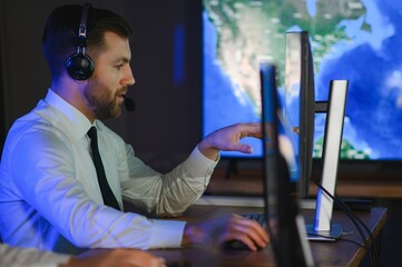 Police dispatch, communication headset and man talking, speaking and consulting with security