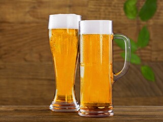 Tasty fresh beer in glass on the desk