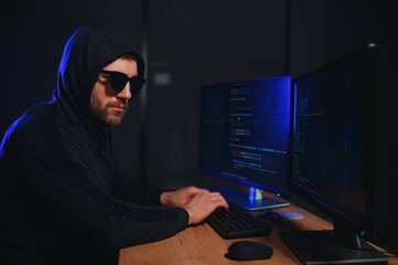 Hacker is hacking into the computer network. Computer criminal