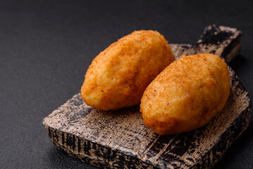 Delicious chicken Kiev or potato cutlets with salt, spices and herbs