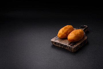 Delicious chicken Kiev or potato cutlets with salt, spices and herbs