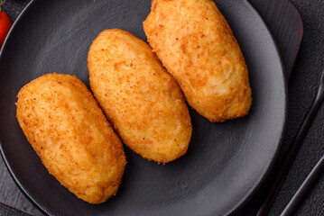 Delicious chicken Kiev or potato cutlets with salt, spices and herbs