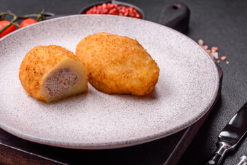 Delicious chicken Kiev or potato cutlets with salt, spices and herbs