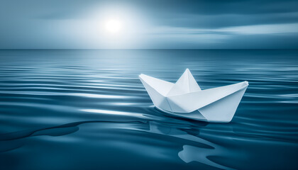 Obraz premium paper boat on blue water