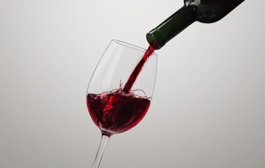 Elegance of tasty Red Wine Pouring into a glass,