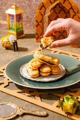 Kue lidah kucing with chocolate jam is a small Indonesian biscuit (kue kering) shaped somewhat like a cat's tongue (long and flat). They are sweet and crunchy.