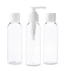 Three Clear Plastic Bottles With White Caps and Pumps on a White Background