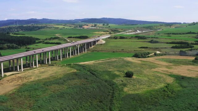 Aerial view of European route E50 highway through green agricultural fields landscape connecting European continent, Levoca