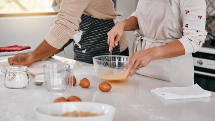 Home, kitchen and hands of couple with cooking for meal prep, support and mixing off eggs on table. Whisk, bowl and people with food ingredients in house for healthy diet, dinner and help in marriage