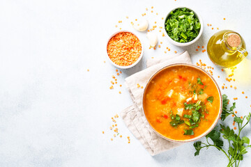 Red lentil soup, traditional middle eastern food on white background. Top view with space for design.