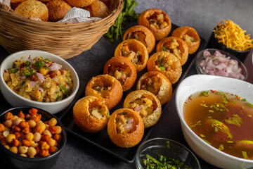 Exploring the Tangy, Spicy, and Refreshing Delight of Pani Puri. India's Favourite Street Food Experience. Selective focus. 