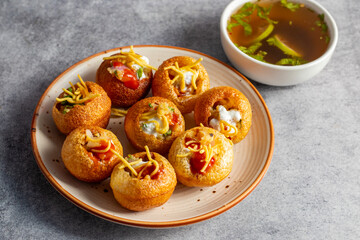 Exploring the Tangy, Spicy, and Refreshing Delight of Pani Puri. India's Favourite Street Food Experience. Selective focus. 