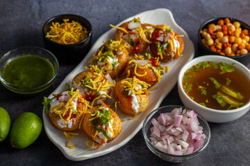 Exploring the Tangy, Spicy, and Refreshing Delight of Pani Puri. India's Favourite Street Food Experience. Selective focus. 