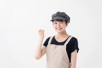 ガッツポーズする飲食業女性