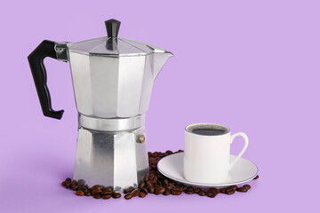 Geyser coffee maker with cup and beans on purple background