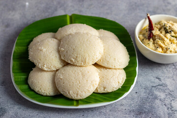 selective focus of "idli" food made with fermented rice popular in South India. Serve with green chutney. 