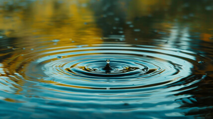 In a calm lake, one drop of water creates waves that spread around. This sight reminds us of the need to care for water resources through recycling and reuse.

