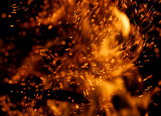 fire flame with sparks on black background.