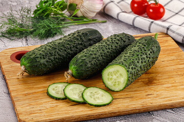 Raw green cucumbers with slices