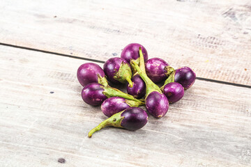 Small organic young purple round eggplant