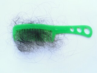 Damaged loose hair after combing, isolated on white background