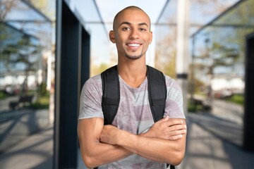 Young happy student man at university campus.