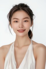 An asian beauty model smile pose in front of a white background