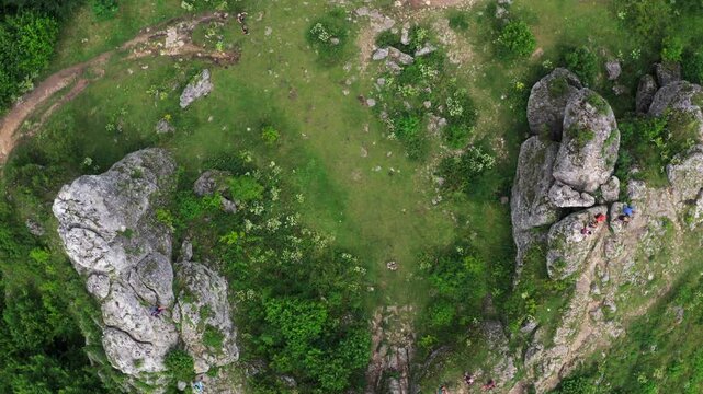 Overhead aerial view of rock climbing in Zborow Mountain limestone cliff surrounded by natural forest