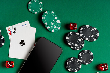 Playing Cards, Chips, and Cash on a Green Felt Surface With a Smartphone