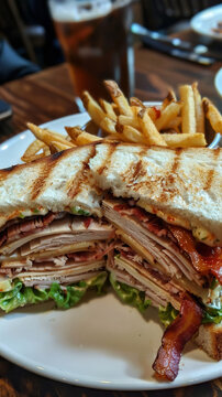 A classic club sandwich with layers of turkey baco 7 1 baking, baking cup, cake, color, cuisine, cup, cupcake, dessert, dish, food, furniture, high-key, knife, on1 keyword ai, sandwich, table, weapon,