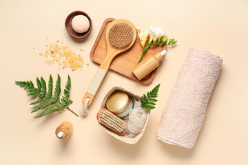 Composition with spa accessories, cosmetics and fern leaves on color background