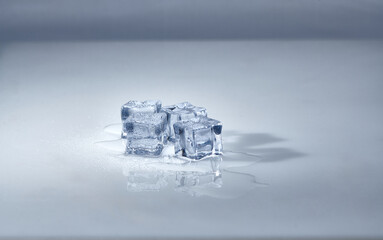 Melting ice cubes on a white background