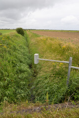 Monitored drainage ditch in the flat lands of the Lincolnshire countryside