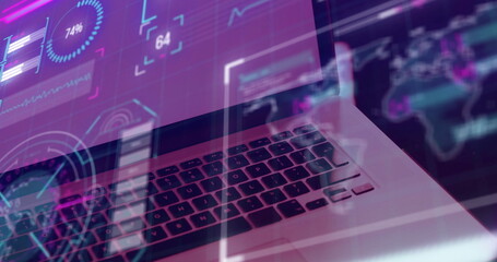 Image of screens with data processing over laptop