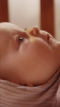 Close up hands father playing with cute charming newborn little baby lying in cradle smiling looking on daddy. Parentheses. Child. Slow motion