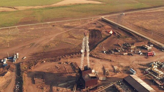 Cinematic Drone Footage. Drilling rig in oil field for drilled into subsurface in order to produced crude. Petroleum Industry. Drone view.