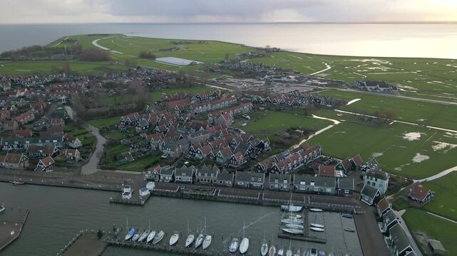 Aerial view of village, houses, church, harbour, boat, sunrise, lake, coast, island, Marken, North-Holland, Netherlands.