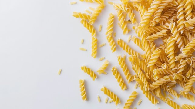 Uncooked Chifferi Rigati Pasta Scattered on White Table Fat and Unhealthy Food Classic Dry Macaroni Italian Culture and Cuisine Raw Pasta