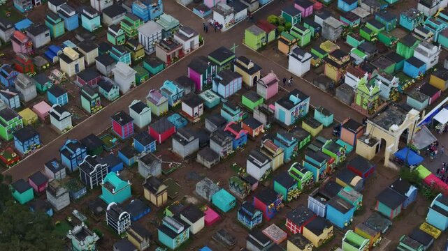 Aerial view of vibrant kite festival celebration in Sumpango, Guatemala.