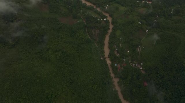 Aerial view of remote, lush river winding through untouched forest and hills, Semuc Champey, Alta Verapaz, Guatemala.
