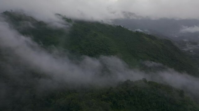Aerial view of misty rainforest and river in remote Semuc Champey, Alta Verapaz, Guatemala.