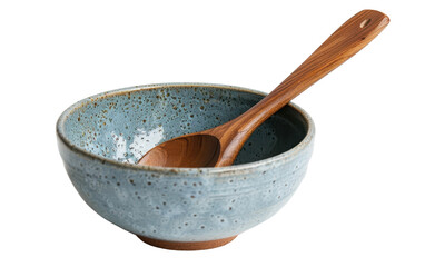 A ceramic bowl with a speckled blue glaze and a wooden spoon rest inside