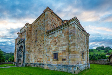 View from the rear and perspective of the church of San Pedro ad Vincula in Li&eacute;rganes, Cantabria, Spain, Renaissance style and colorful sky at sunset