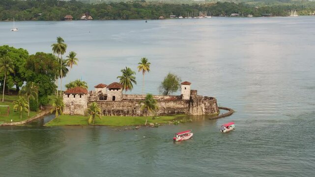 Aerial view of medieval Castillo de San Felipe by the tranquil lake, Rio Dulce, Izabal, Guatemala.