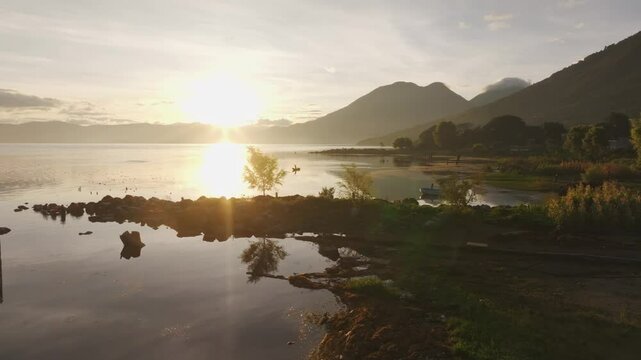 Aerial view of sunrise over Lake Atitlan with majestic volcanoes, San Pedro La Laguna, Solola, Guatemala.