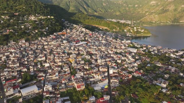 Aerial view of city, lake, and mountain with sunrise, San Pedro La Laguna, Solola, Guatemala.